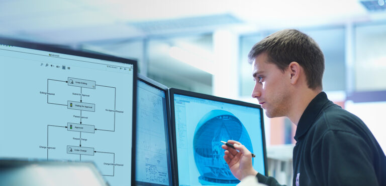 engineer sitting at desk using SOLIDWORKS design software